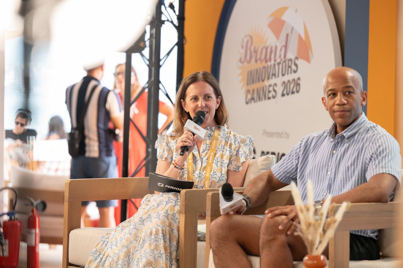 Two speakers seated on stage at Brand Innovators Cannes 2026 discussion panel.