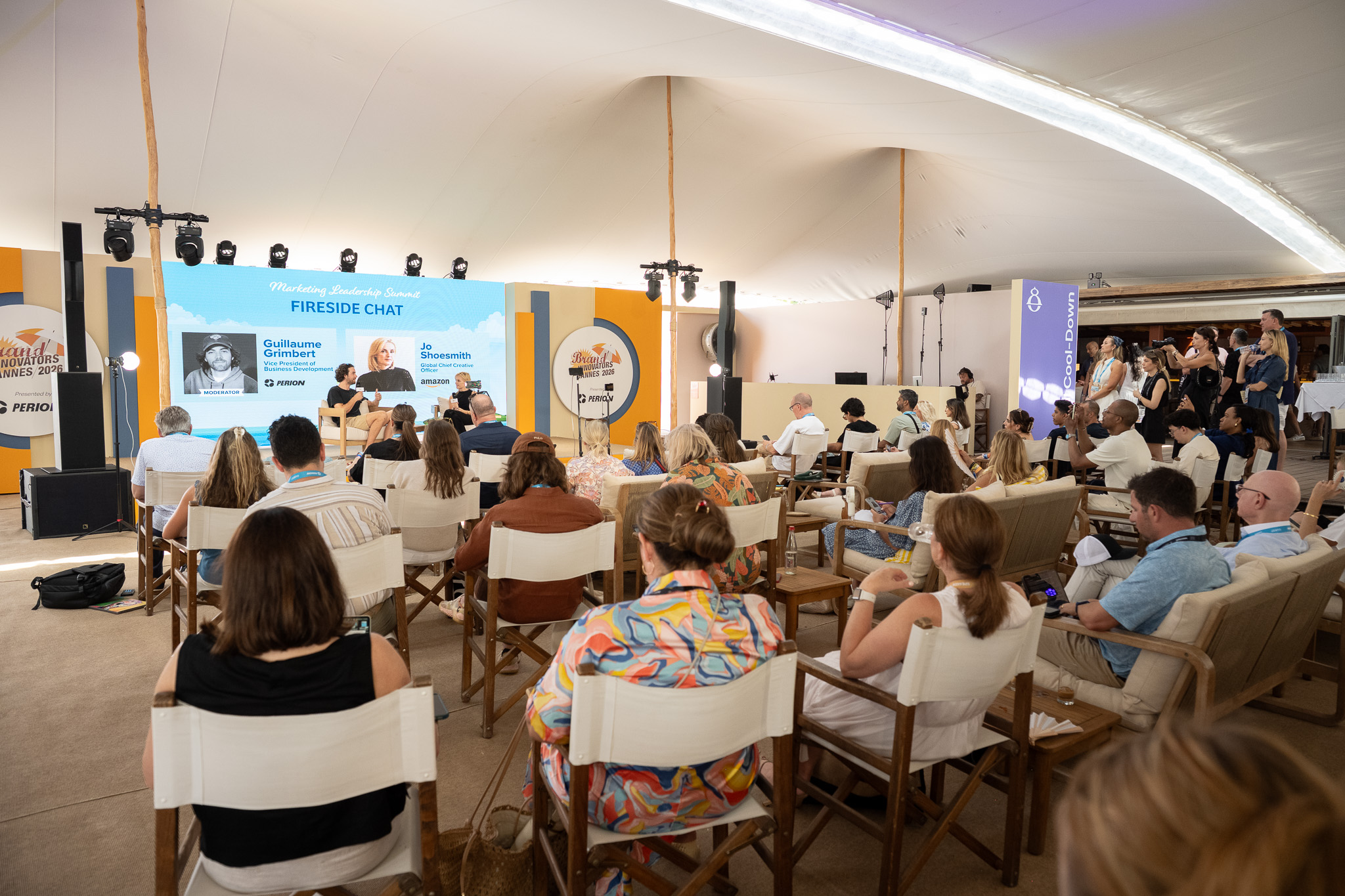 Audience attends fireside chat at Brand Innovators Cannes 2026 event.